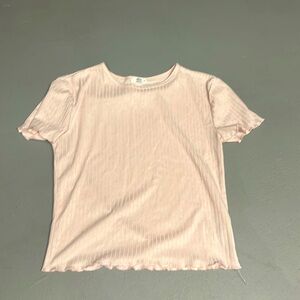 Baby tee that’s light pink with ripples from Ardene.